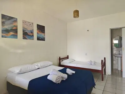Uma cama ou camas num quarto em Casa Jambo Canoa Quebrada
