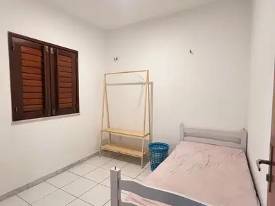 Uma cama ou camas num quarto em Casa Paracuru
