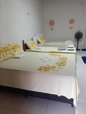 Uma cama ou camas num quarto em Cantinho do sossego