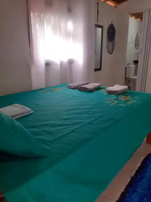 Uma cama ou camas num quarto em Cantinho do sossego