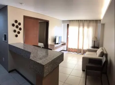 Uma televisão e/ou sistema de entretenimento em Beach Front Apartment Kariri