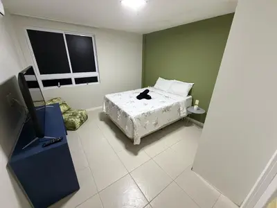 Uma cama ou camas num quarto em Terramaris vista mar