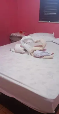 Uma cama ou camas num quarto em Ambiente agradável
