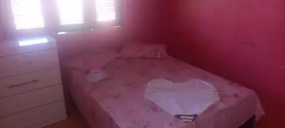 Uma cama ou camas num quarto em Ambiente agradável