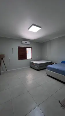 Uma cama ou camas num quarto em Villa Familia Preá