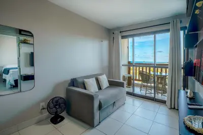 Uma área de estar em VG Sun Cumbuco #403 Vista Mar by Carpediem