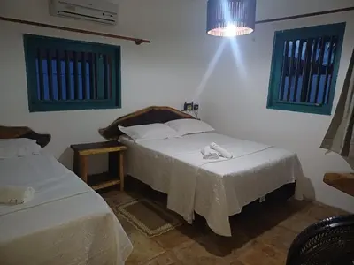 Uma cama ou camas num quarto em house in icaraizinho de amontada