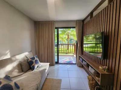 Uma televisão e/ou sistema de entretenimento em VG SUN Cumbuco - Apartamento pé na areia