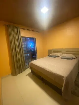 Uma cama ou camas num quarto em Casa Varanda Guaramiranga