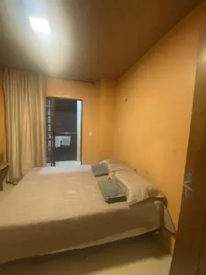 Uma cama ou camas num quarto em Casa Varanda Guaramiranga