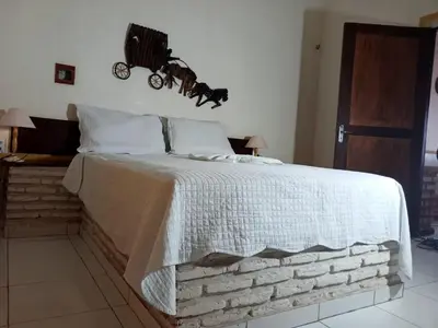 Uma cama ou camas num quarto em Chales lua mar e sol