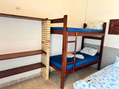Uma cama ou camas num quarto em Casa Alemao Caponga