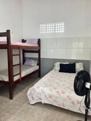 Uma cama ou camas num quarto em Casa Alemao Caponga