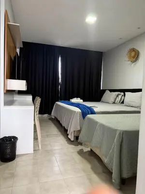 Uma cama ou camas num quarto em Atlas Beach Hotel