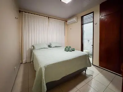 Uma cama ou camas num quarto em Casa Paraíso do Cumbuco- 5 Quartos AC- Piscina Privativa- 50m do Mar