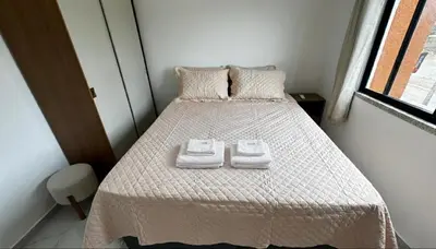 Uma cama ou camas num quarto em Conforto, lazer e otima localização - Beach Park