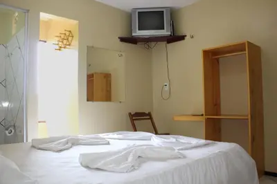 Uma cama ou camas num quarto em Pousada Vital