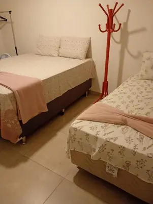 Uma cama ou camas num quarto em Sítio Chalé Primavera