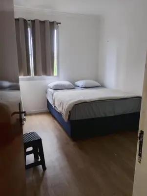 Uma cama ou camas num quarto em Apartamento 3 quartos avenida do futuro