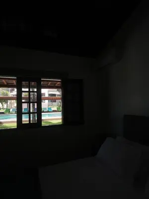 Uma cama ou camas num quarto em Beachfront Retreat with Pool and Garden