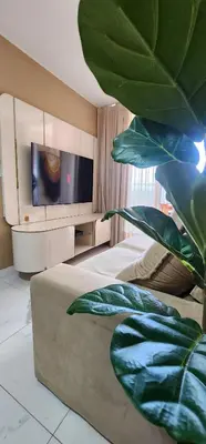 Uma televisão e/ou sistema de entretenimento em Aquarius by DS Imoveis