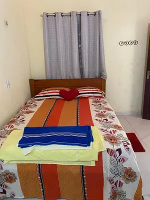 Uma cama ou camas num quarto em Pousada da vila
