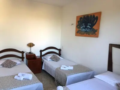 Uma cama ou camas num quarto em Shekinah House