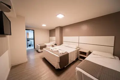 Uma cama ou camas num quarto em Hotel Praia Mar