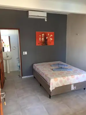 Uma cama ou camas num quarto em Pousada Villa Calango