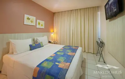 Uma cama ou camas num quarto em Maredomus Hotel