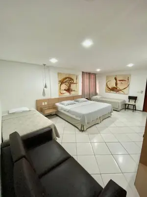 Uma cama ou camas num quarto em Hotel Cocal