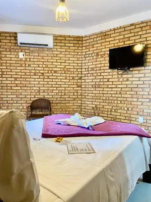 Uma cama ou camas num quarto em Pousada Casa Do Alemão