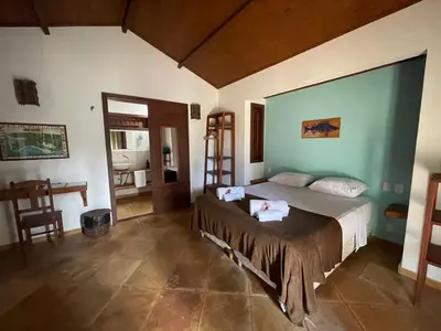 Uma cama ou camas num quarto em Pousada Vila Icaraí