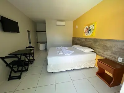 Uma cama ou camas num quarto em Pousada Dunas Beach