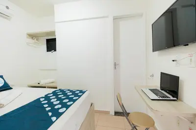 Uma televisão e/ou sistema de entretenimento em Pousada Meireles