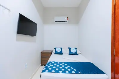 Uma cama ou camas num quarto em Pousada Meireles