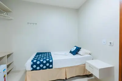 Uma cama ou camas num quarto em Pousada Meireles