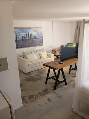 Uma área de estar em Inn Tribus Hotel