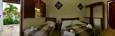Uma cama ou camas num quarto em Pousada Califórnia Tia Lia