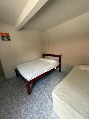 Uma cama ou camas num quarto em Pousada Sol Dourado