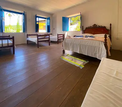 Uma cama ou camas num quarto em Casarão dos Uchoa