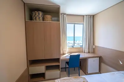 Uma cama ou camas num quarto em Fortaleza Mar Hotel