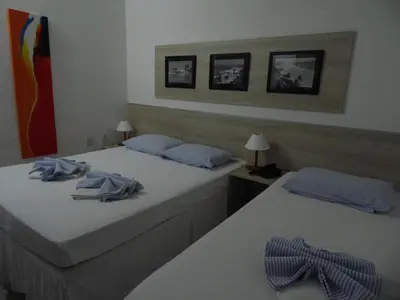 Uma cama ou camas num quarto em Hotel Praia do Futuro