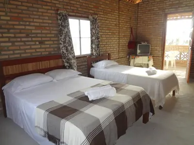 Uma cama ou camas num quarto em Pousada Sol e Mar