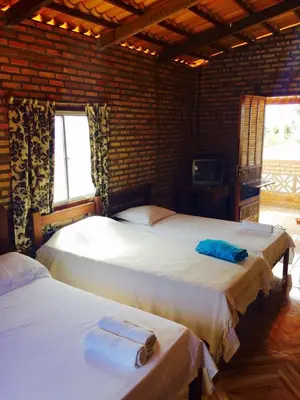 Uma cama ou camas num quarto em Pousada Sol e Mar