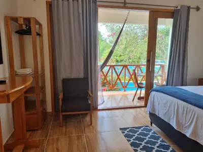 Uma cama ou camas num quarto em Pousada e Restaurante Paraíso Natural