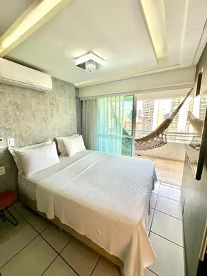 Uma cama ou camas num quarto em Beira Mar Apto 16º andar Luxo 2 quartos