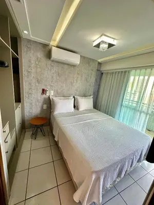 Uma cama ou camas num quarto em Beira Mar Apto 16º andar Luxo 2 quartos