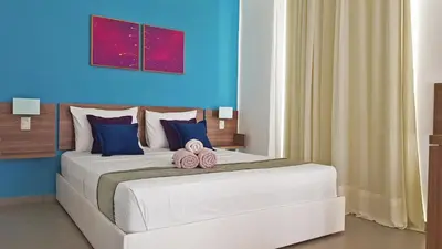 Uma cama ou camas num quarto em Ravenala Hotel Boutique