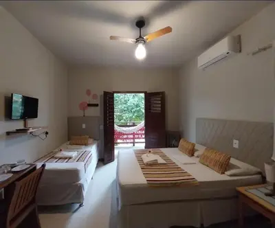 Uma cama ou camas num quarto em Pousada Munguba